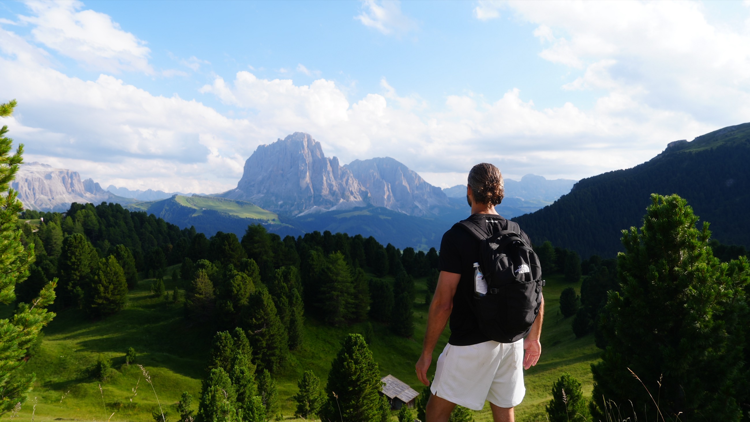 Matt Gray hiking toward the Sassolungo group in the Dolomites