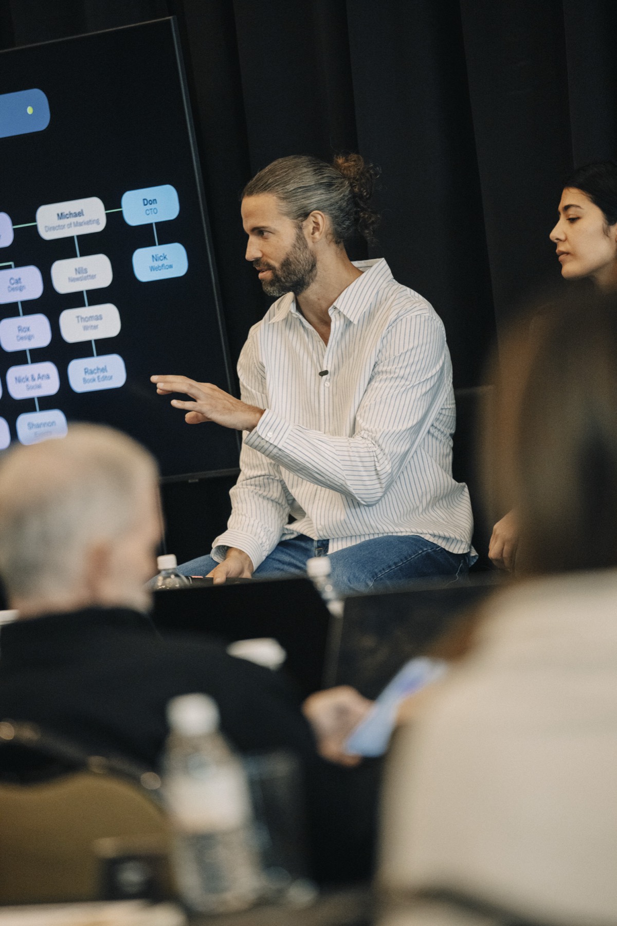 Matt Gray leading a session in front of a strategy board